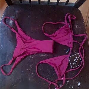 TAGS STILL ON string bikini. maroon color